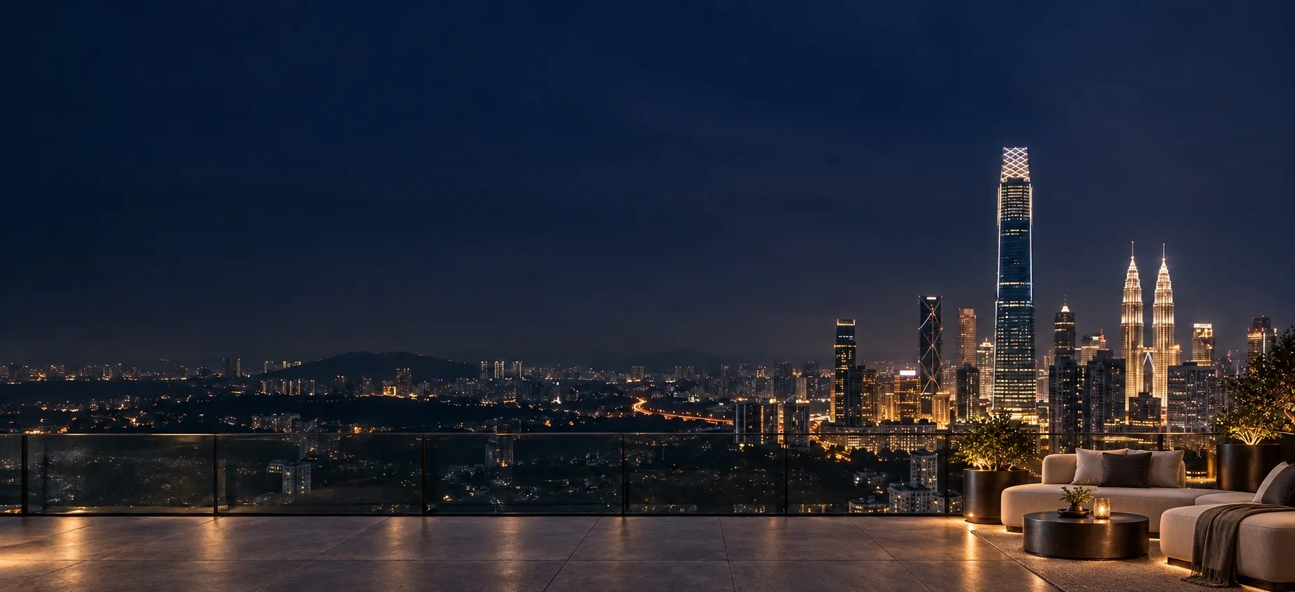 A sky deck lounge at night, overlooking the Kuala Lumpur skyline with Exchange 106 and the Petronas Towers.